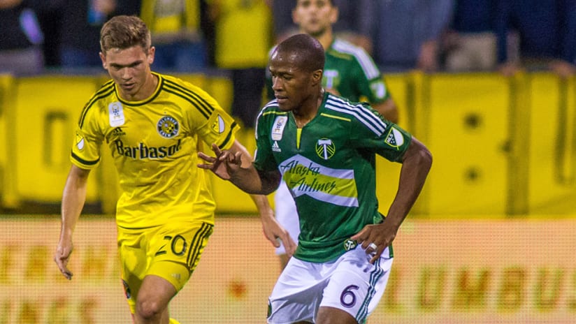 Darlington Nagbe - Portland Timbers - fends off - Wil Trapp - Columbus Crew SC