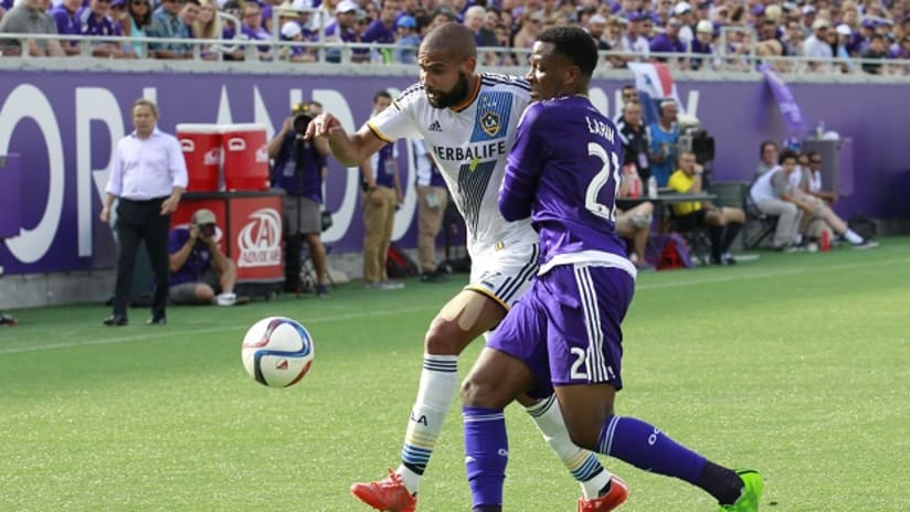 LA Galaxy defender Leonardo battles Orlando City SC's Cyle Larin