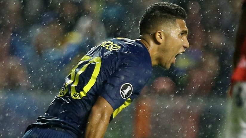 Emanuel Reynoso - celebrating - in the rain