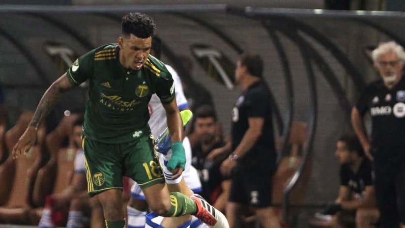 Julio Cascante wins the ball vs. Impact