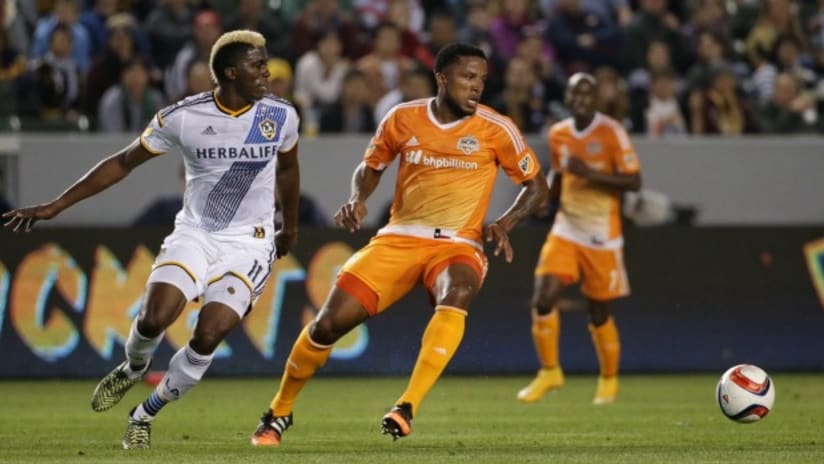 Gyasi Zardes (LA Galaxy) and Jermaine Taylor (Houston Dynamo) track a ball