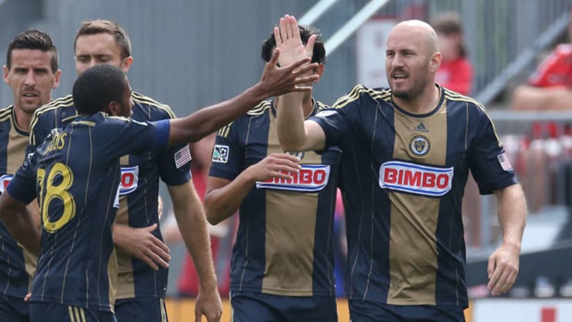 Conor Casey gets a hi-5 (September 6, 2014)