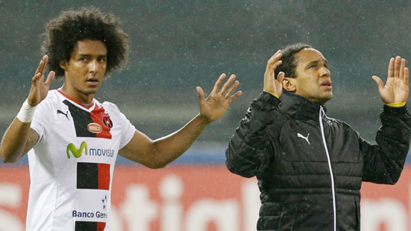 Alajuelense's Jonathan McDonald and Porfirio Lopez