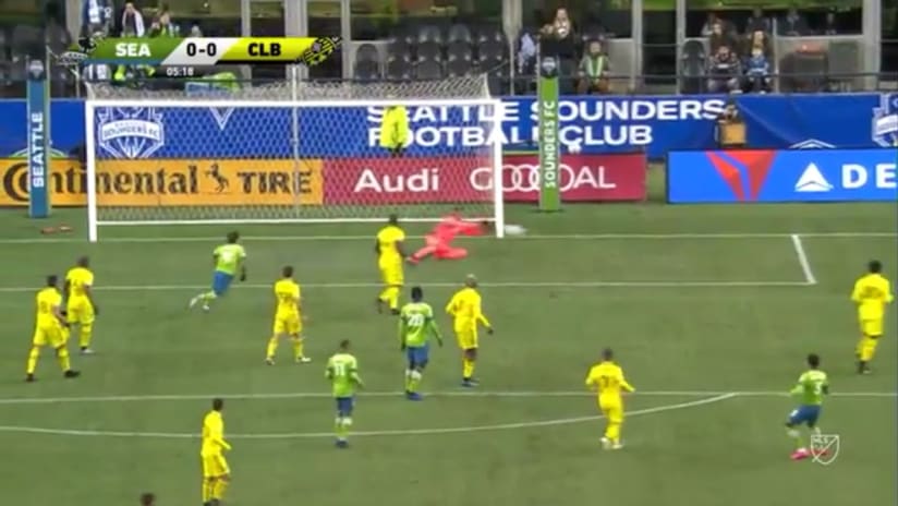 SAVE: Eloy Room parries away a long range Xavier Arreaga shot