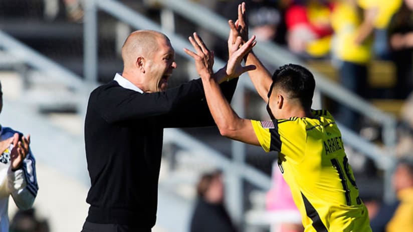 Jairo Arrieta and Gregg Berhalter high five