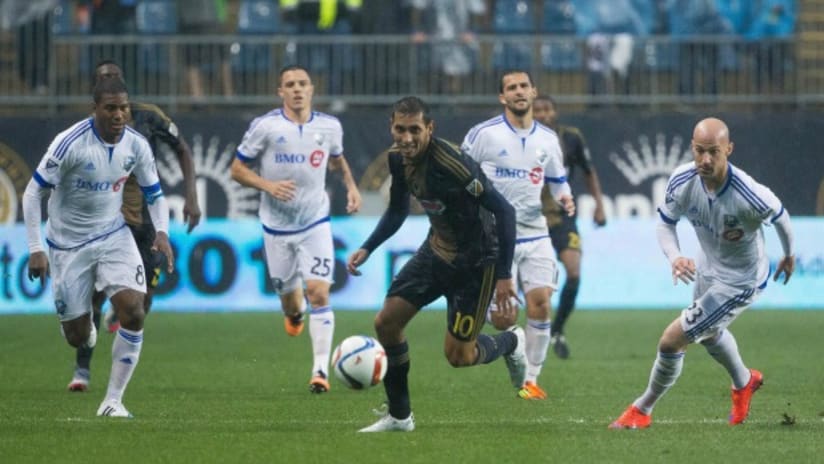 Cristian Maidana (Philadelphia Union) is pursued by the Montreal Impact