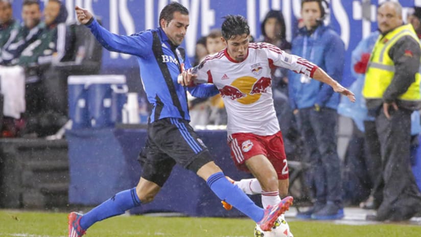 Andres Romero of the Montreal Impact races past Kosuke Kimura of the New York Red Bulls