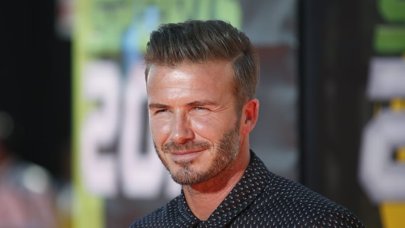 David Beckham smiles