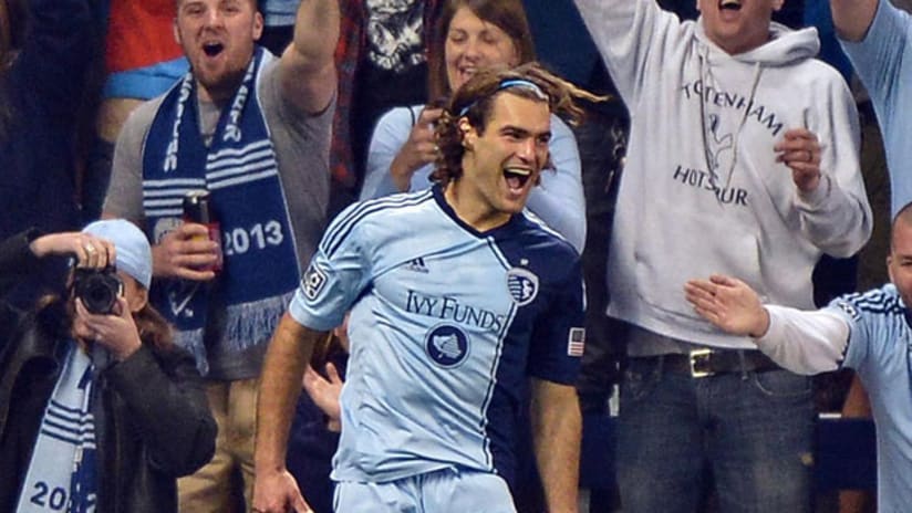 Graham Zusi celebrates in front of Cauldron