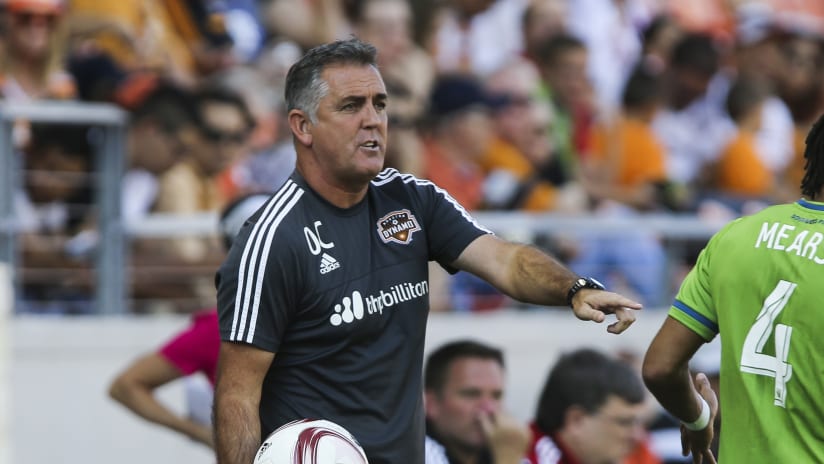 Houston Dynamo head coach Owen Coyle signals towards the field