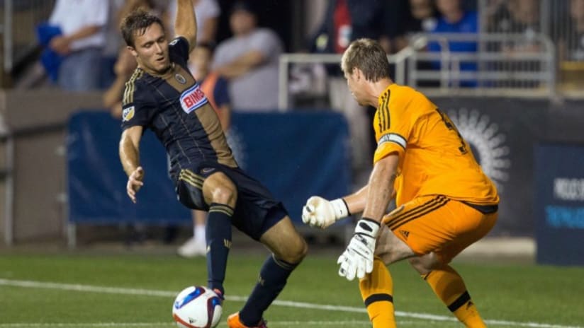 Philadelphia Union's Andrew Wenger drives against DC United's Andrew Dykstra in USOC action