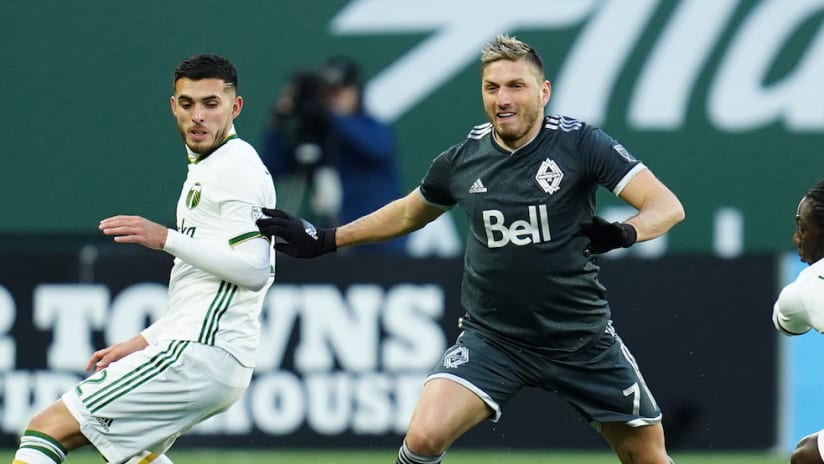 David Milinkovic dribbles vs. Yimmi Chara in preseason at Providence Park