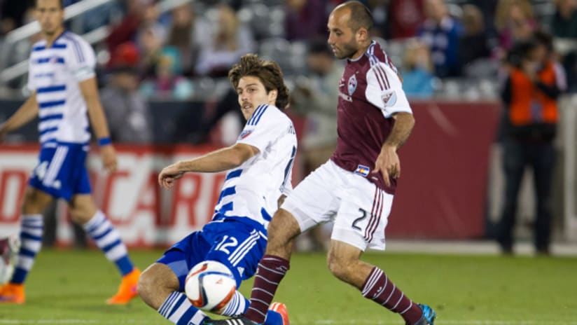 Ryan Hollingshead (FC Dallas) attempts to tackle Nick LaBrocca (Colorado Rapids)