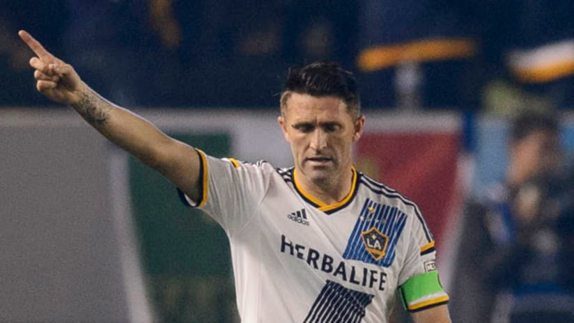 LA Galaxy forward Robbie Keane points to the sky