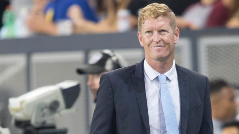 Jim Curtin - wry grin - sideline