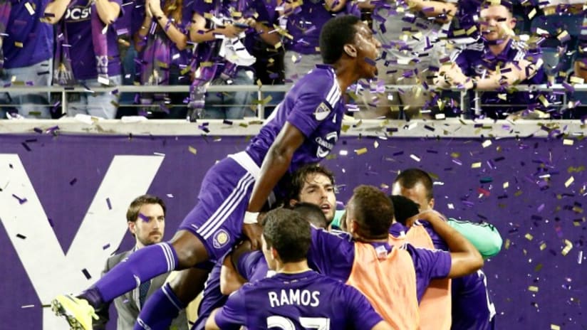 Orlando City players celebrate Aurelien Collin's late equalizer vs. the New England Revolution