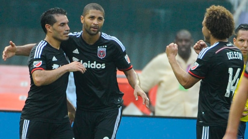 Fabian Espindola, Alvaro Saborio and Nick DeLeon celebrate a goal for DC United