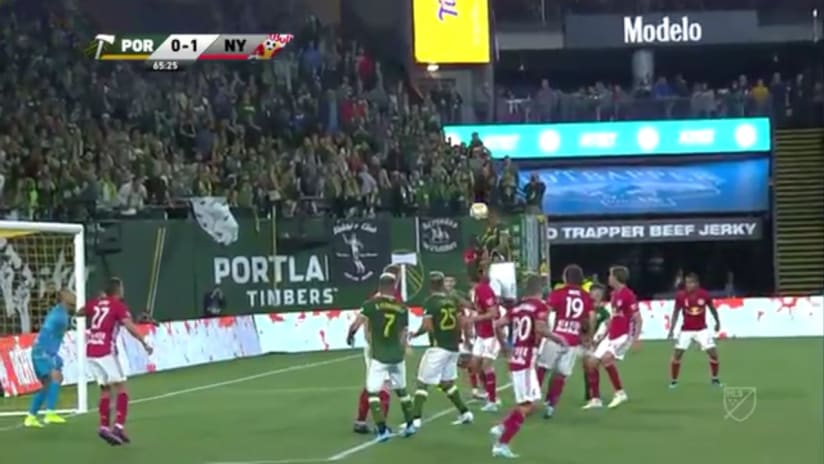 SAVE: Jeremy Ebobisse smashes a header right at Luis Robles