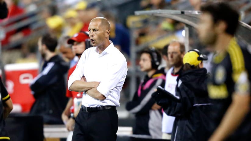 Gregg Berhalter - Columbus Crew SC - Sideline shot, players in foreground