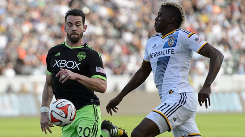 Zach Scott battles Gyasi Zardes