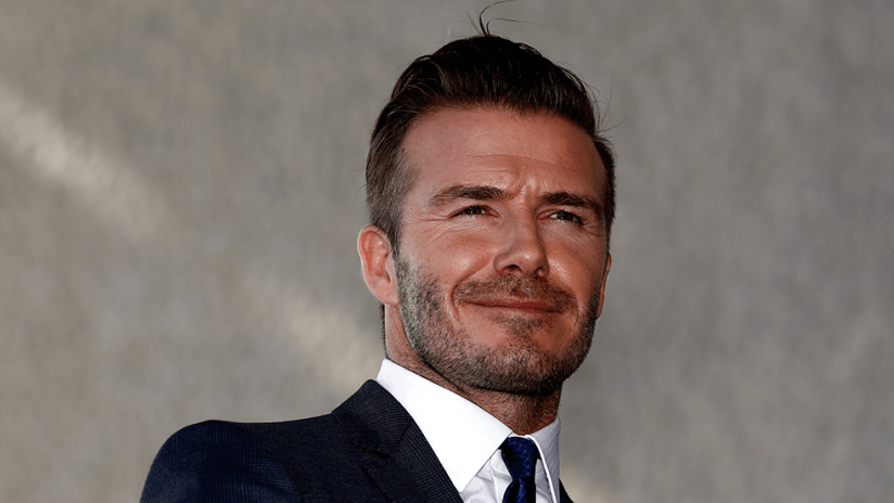 David Beckham - smiling - business suit