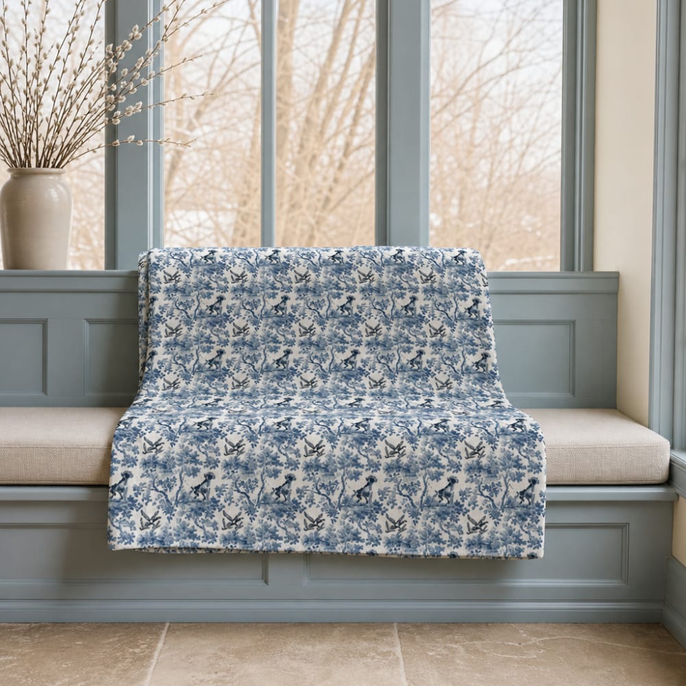 German Shorthaired Pointer blanket in blue toile on a window seat