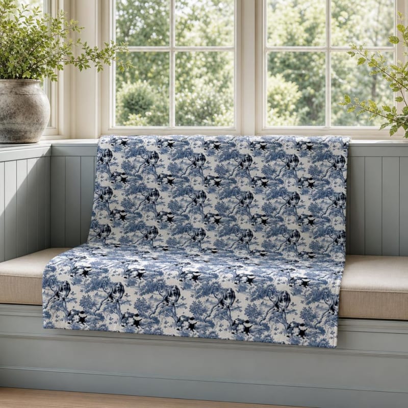 Basset Hound breed toile blanket on a window seat