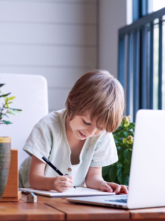 Young child, engaged during an online tutoring session