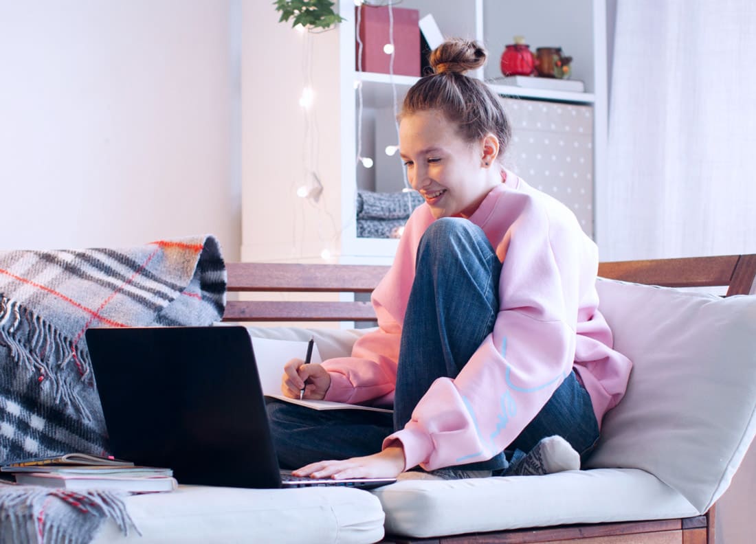 High school student learning online from the comfort of her home