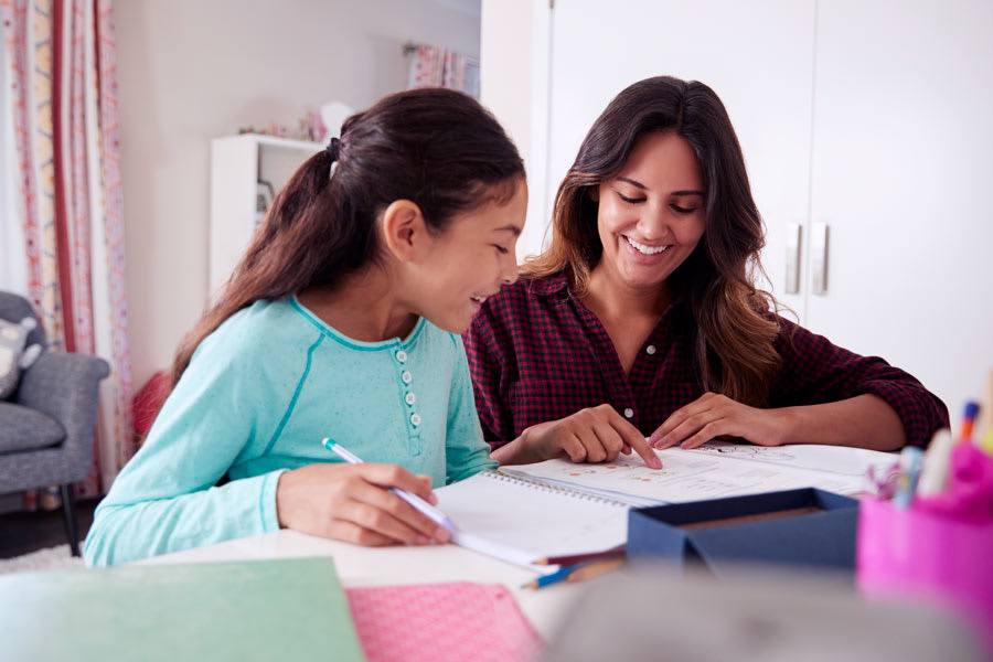mother creating a study timetable for her daughter