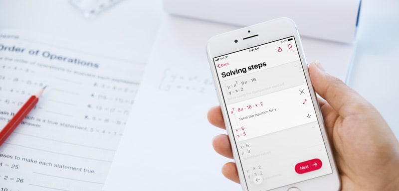 Photomath being used to take photos and solve hand written questions