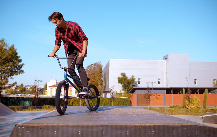 young melbourne teenager doing tricks on a bmx bike