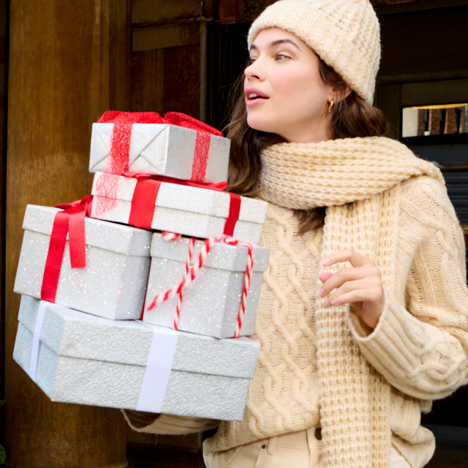 image of a woman holding holiday presents