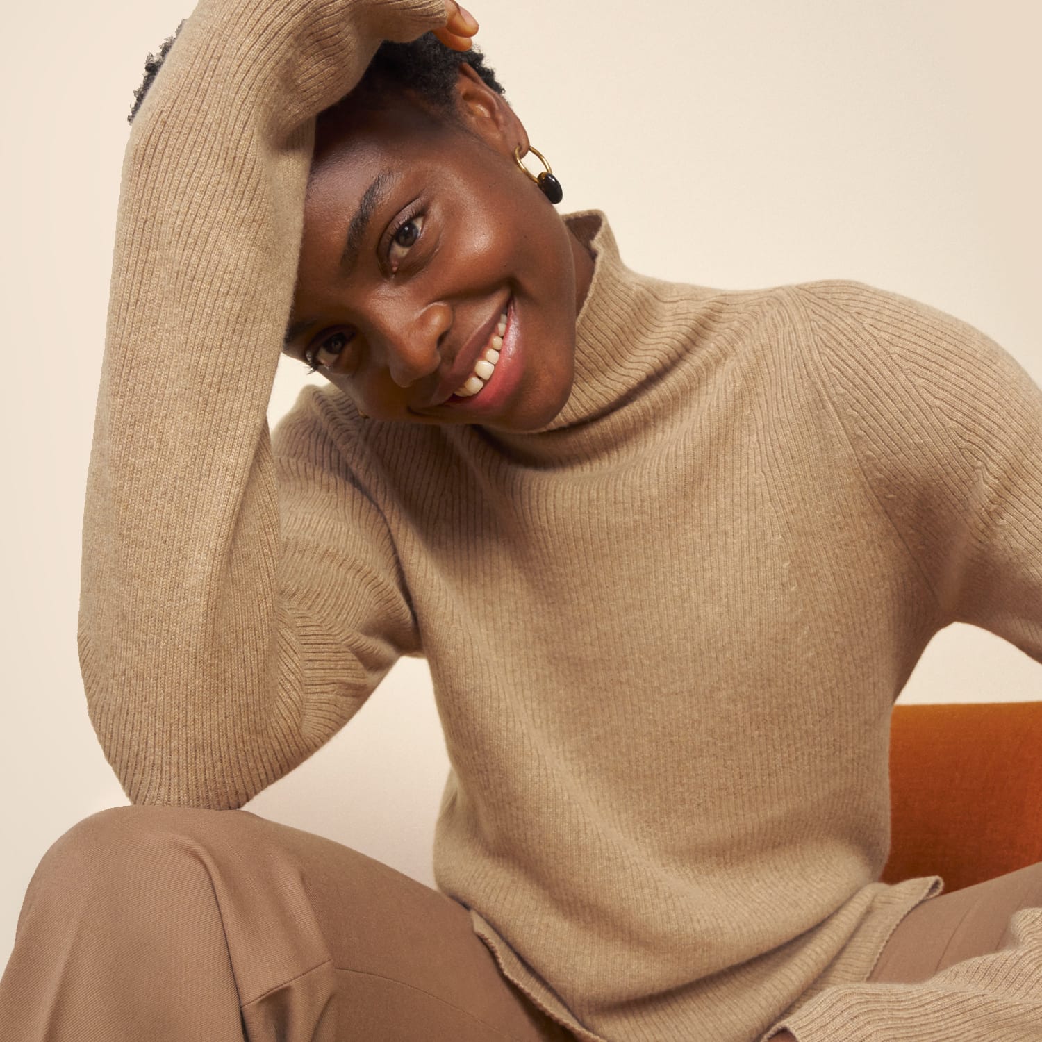 image of a woman wearing the mckenzie sweater in flax