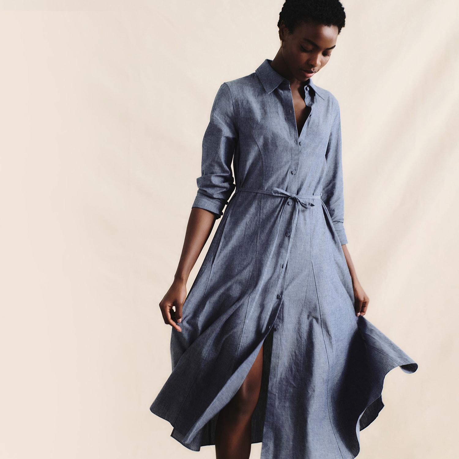 image of a woman wearing the pepper dress in chambray