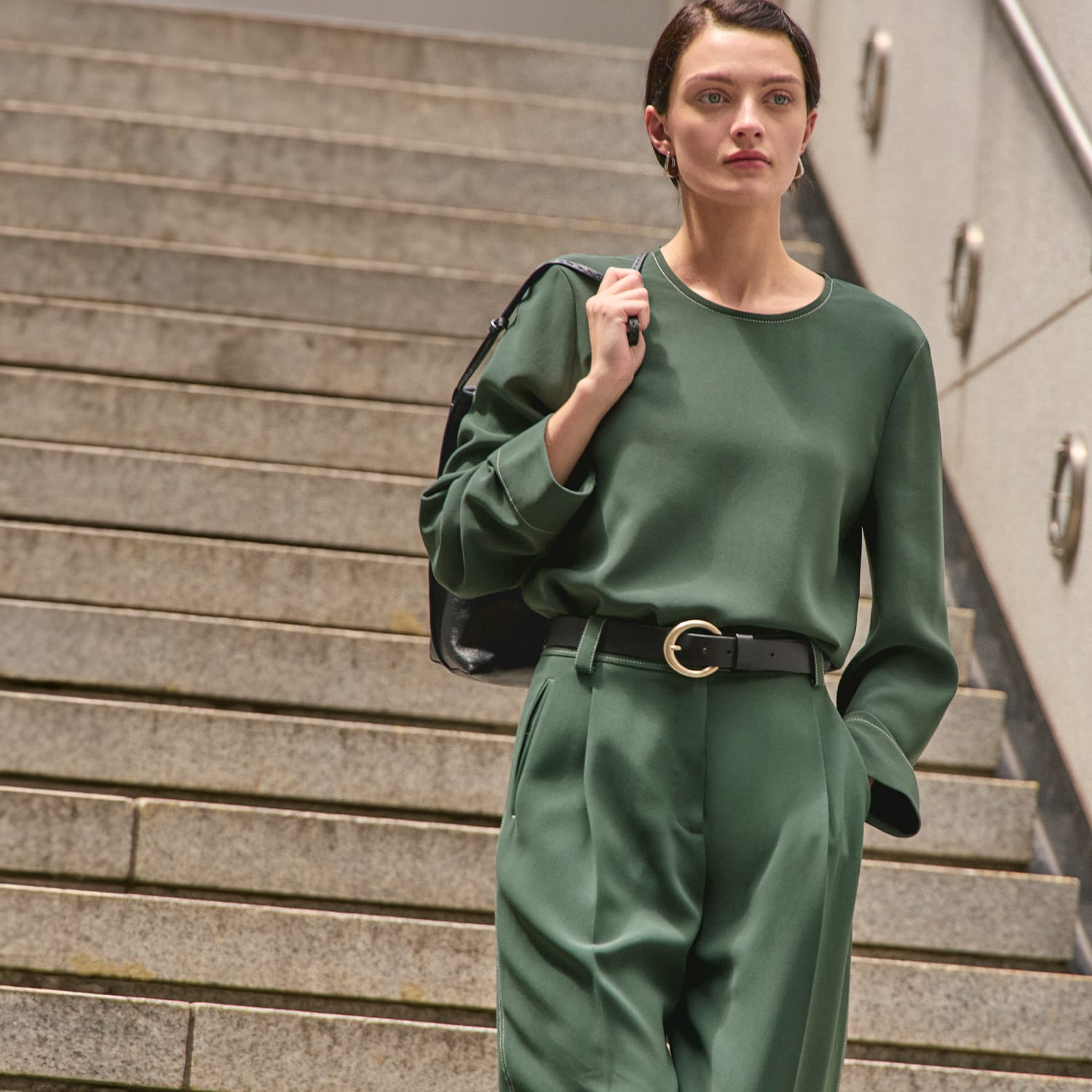 image of a woman wearing the jules top and arlo pants in dusty pine