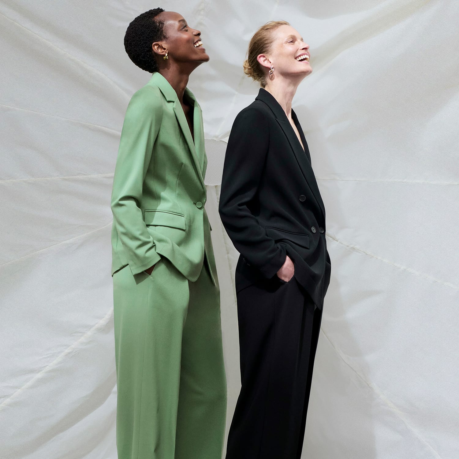 two women wearing washable wool twill suiting