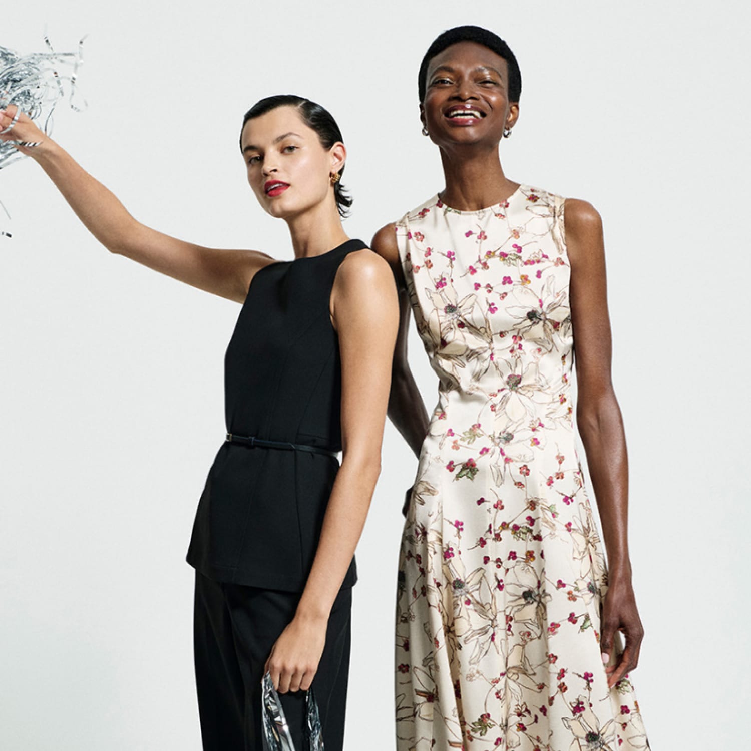 two women holding streamers