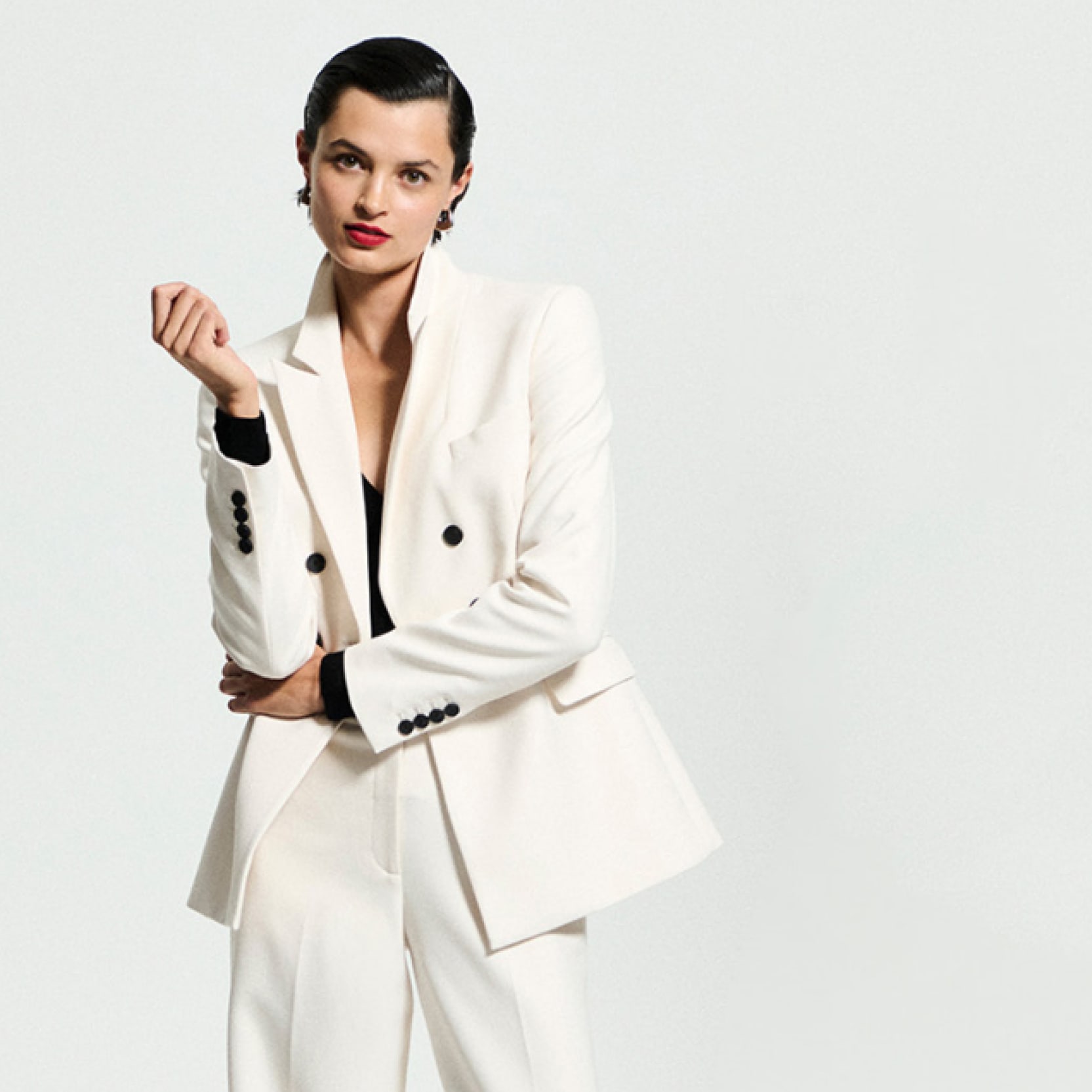 Image of a woman wearing an ivory suit
