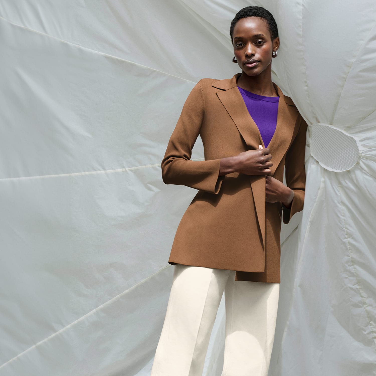 image of a woman wearing the milo jeans in saddle with the kiki sweater