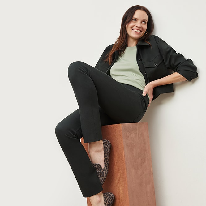 Woman wearing the anna jacket and hockley jean in hemlock with the minty green leslie t shirt and leopard grace loafers