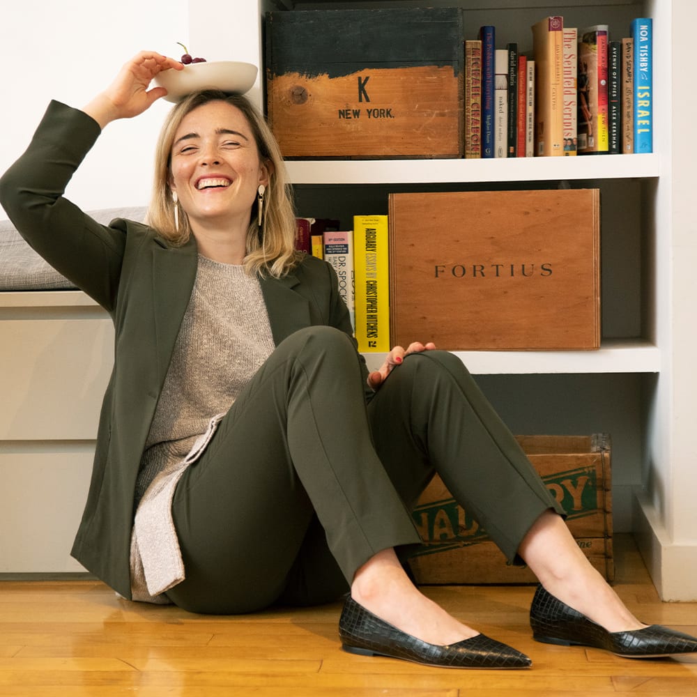 Image of a woman wearing the Moreland Jacket and Colby Pant in Olive