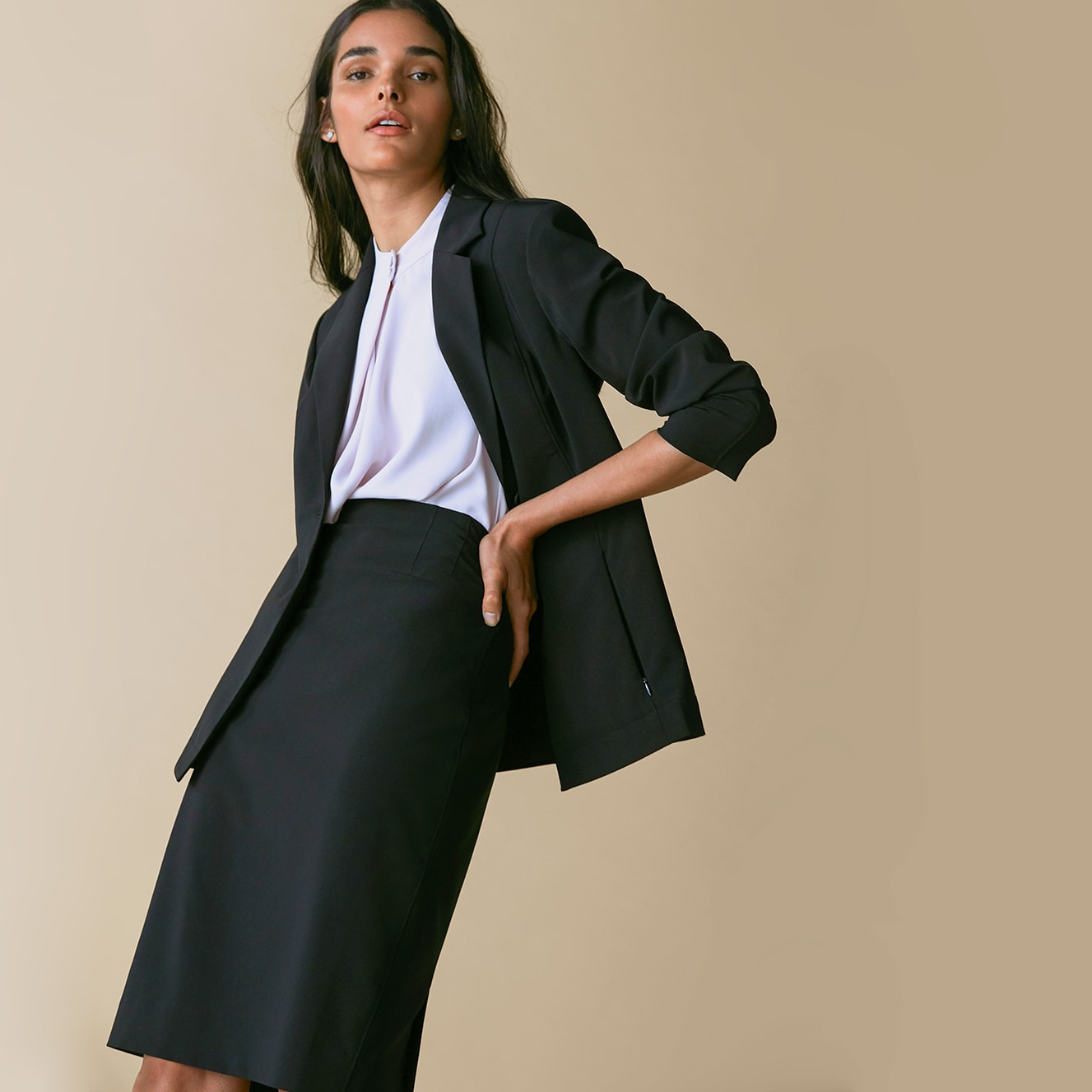 Woman wearing the Moreland jacket and Cobble hill skirt