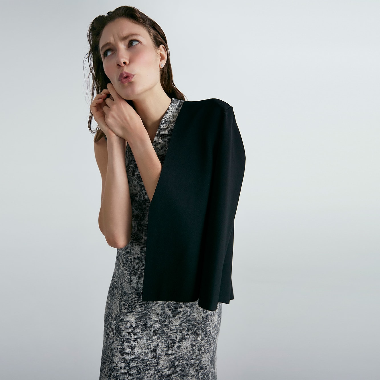 Woman wearing the Aditi dress and Woolf jardigan