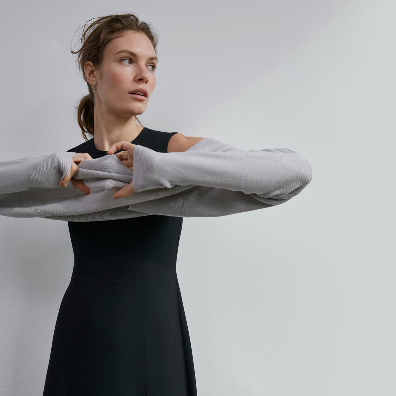 Woman wearing the Jane dress and Butler sweater