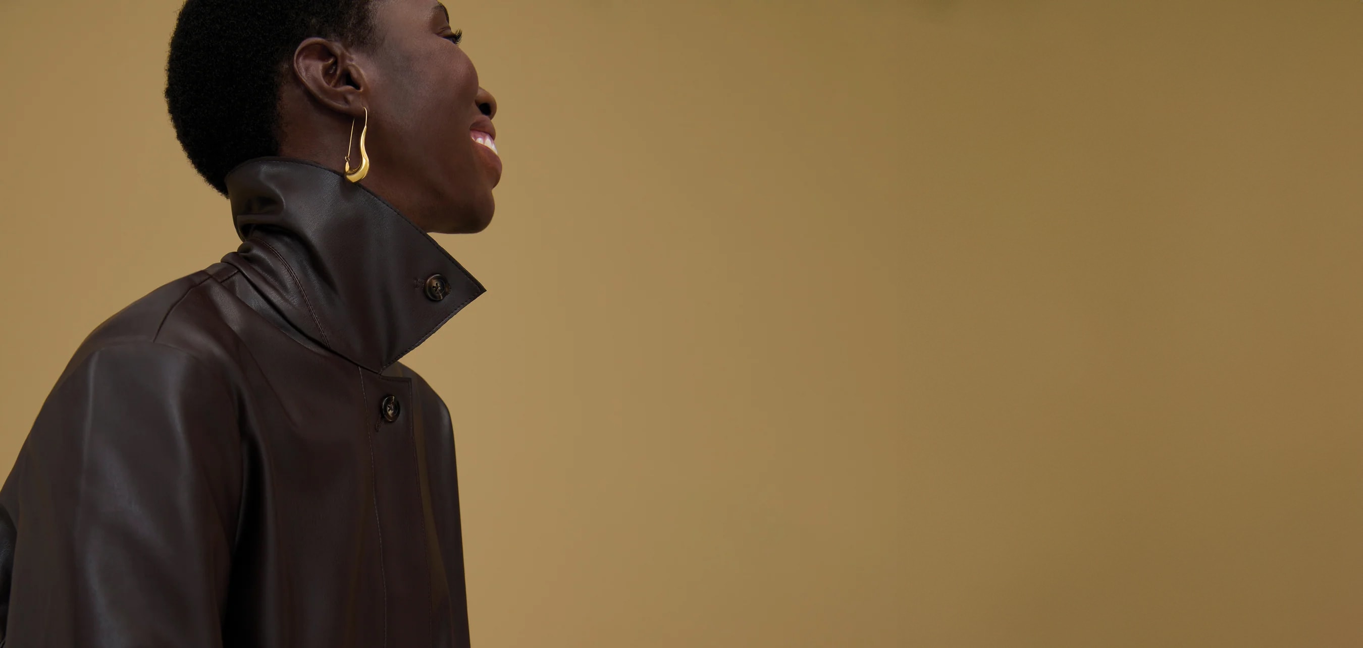 image of a woman wearing a brown leather jacket