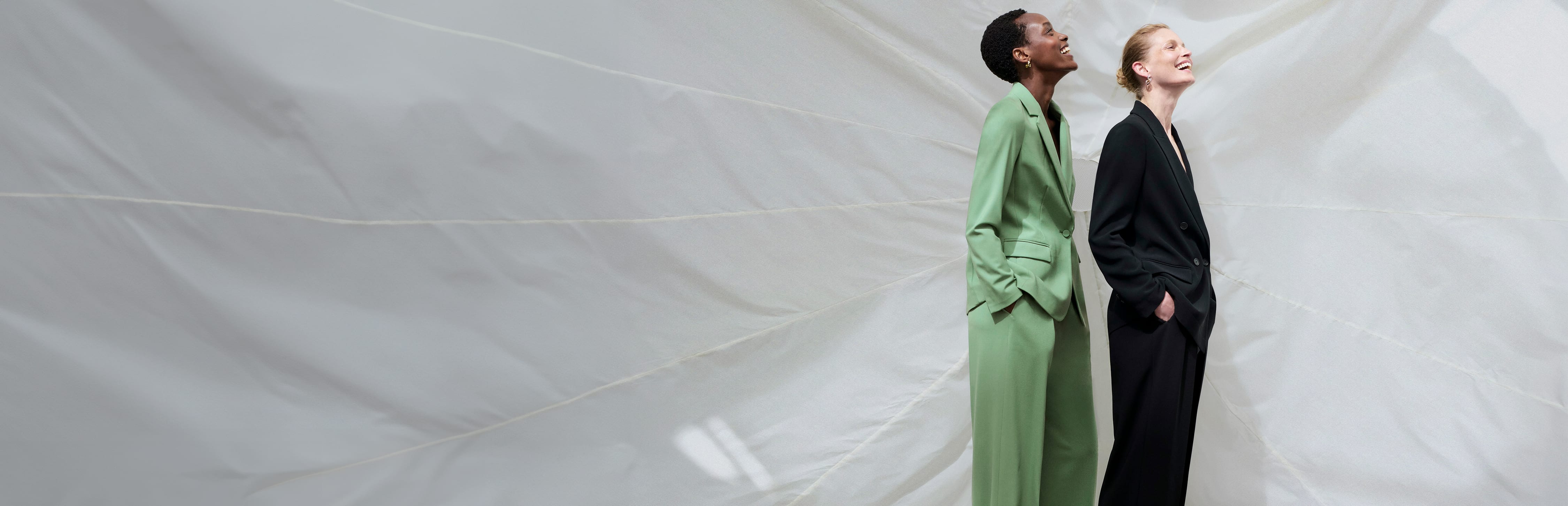 two women wearing washable wool twill suiting