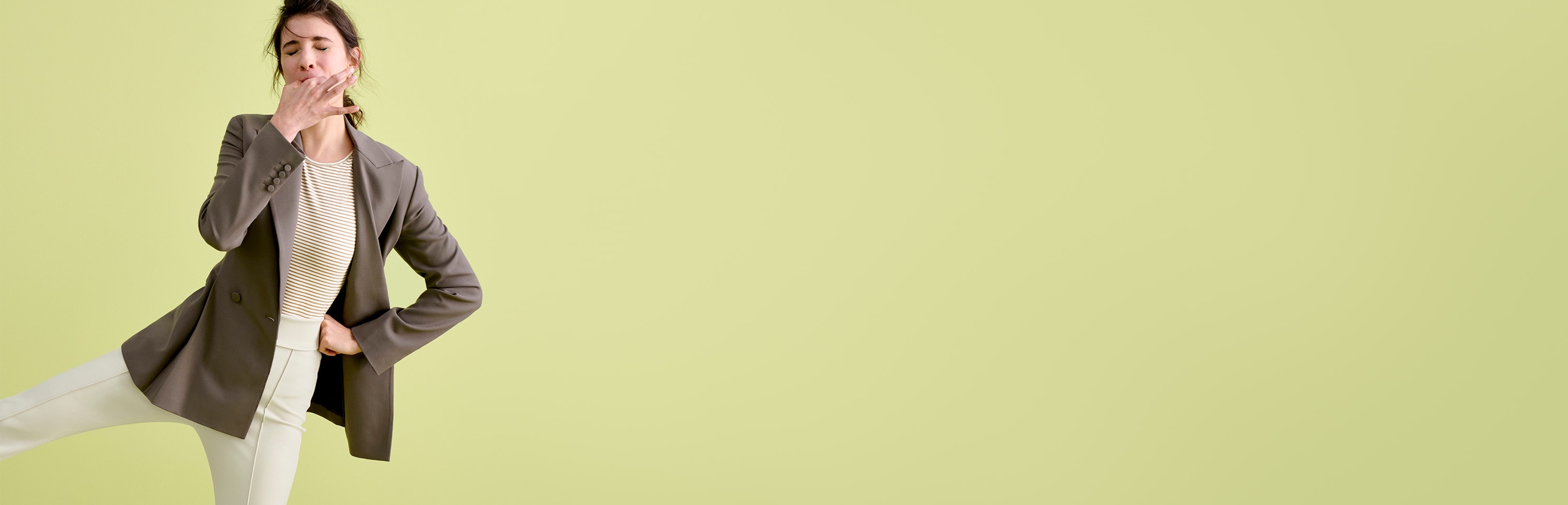 woman whistling and smiling, green background