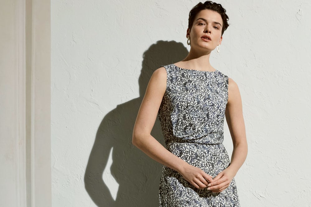 Woman wearing Bergman top and winthrop skirt in ivy print