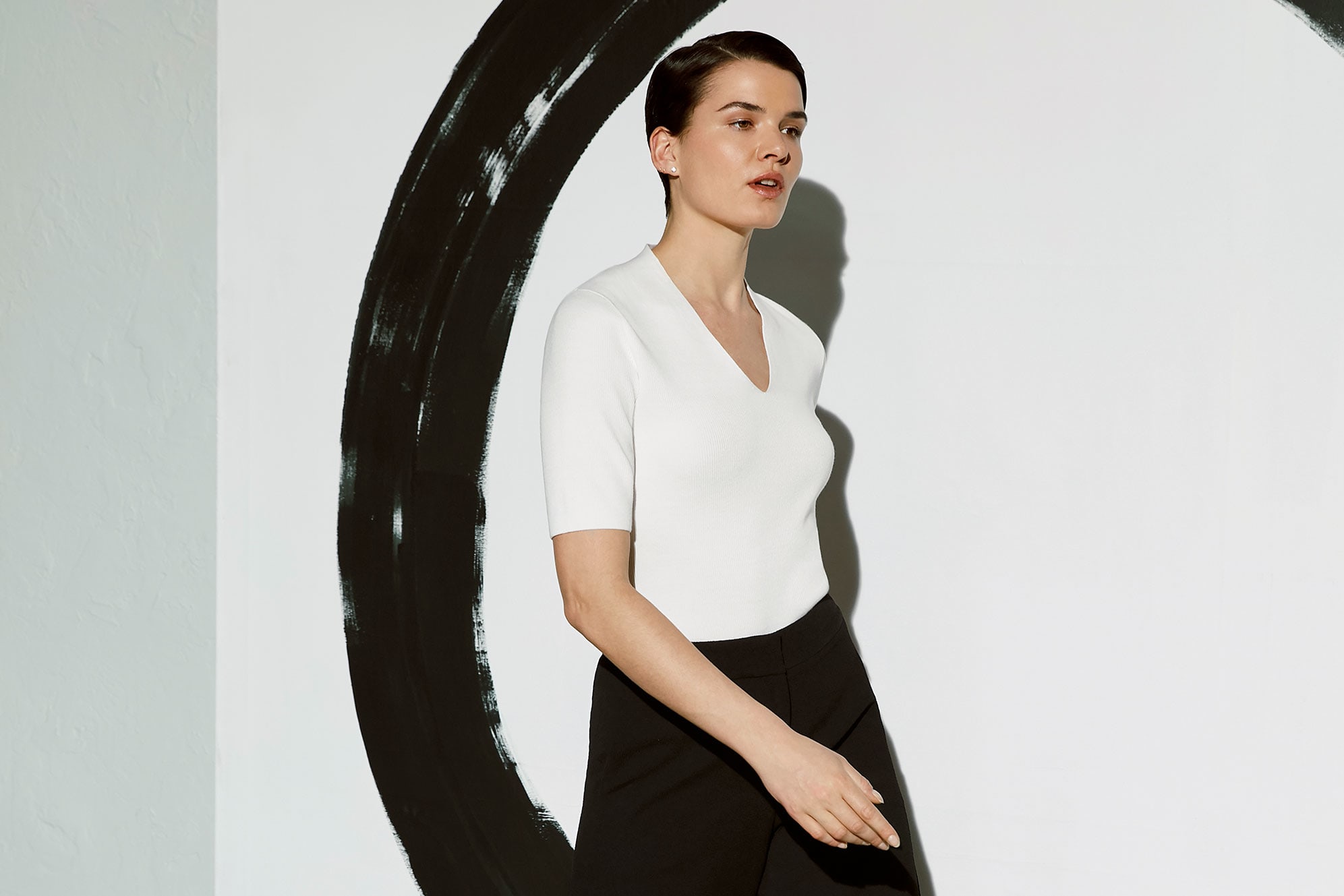Woman in White top and Black pants